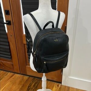 Kate Spade Leather Black Backpack Sleek Design
Some wear noted on front see pics